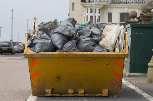 Waste collection truck in Alperton neighborhood